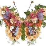 Rouwbloemstuk Fay gemengde vlinder